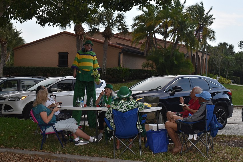 Aaron Watkins visits a table.