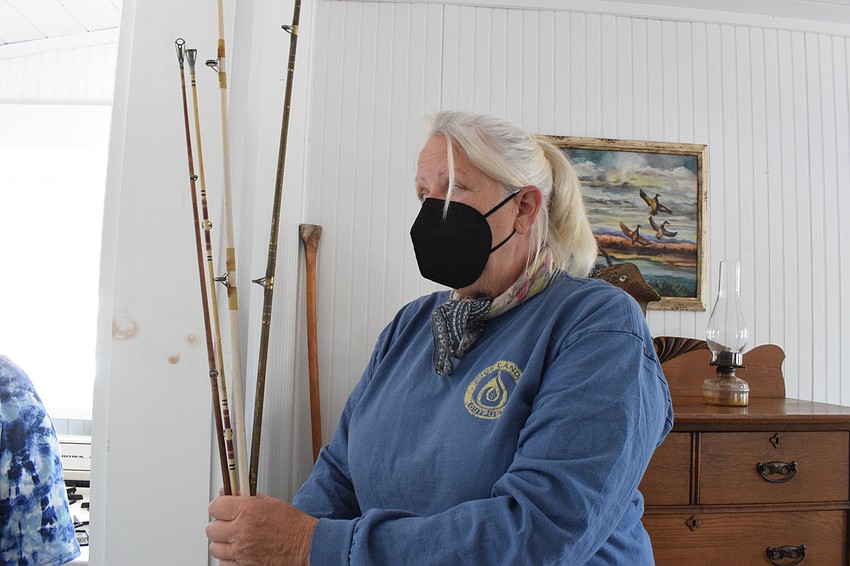 Denise Kleiner, the operator of Jiggs Landing, says people from the community donated fishing poles to be put in the historic Jiggs Landing Fish Camp cabin.