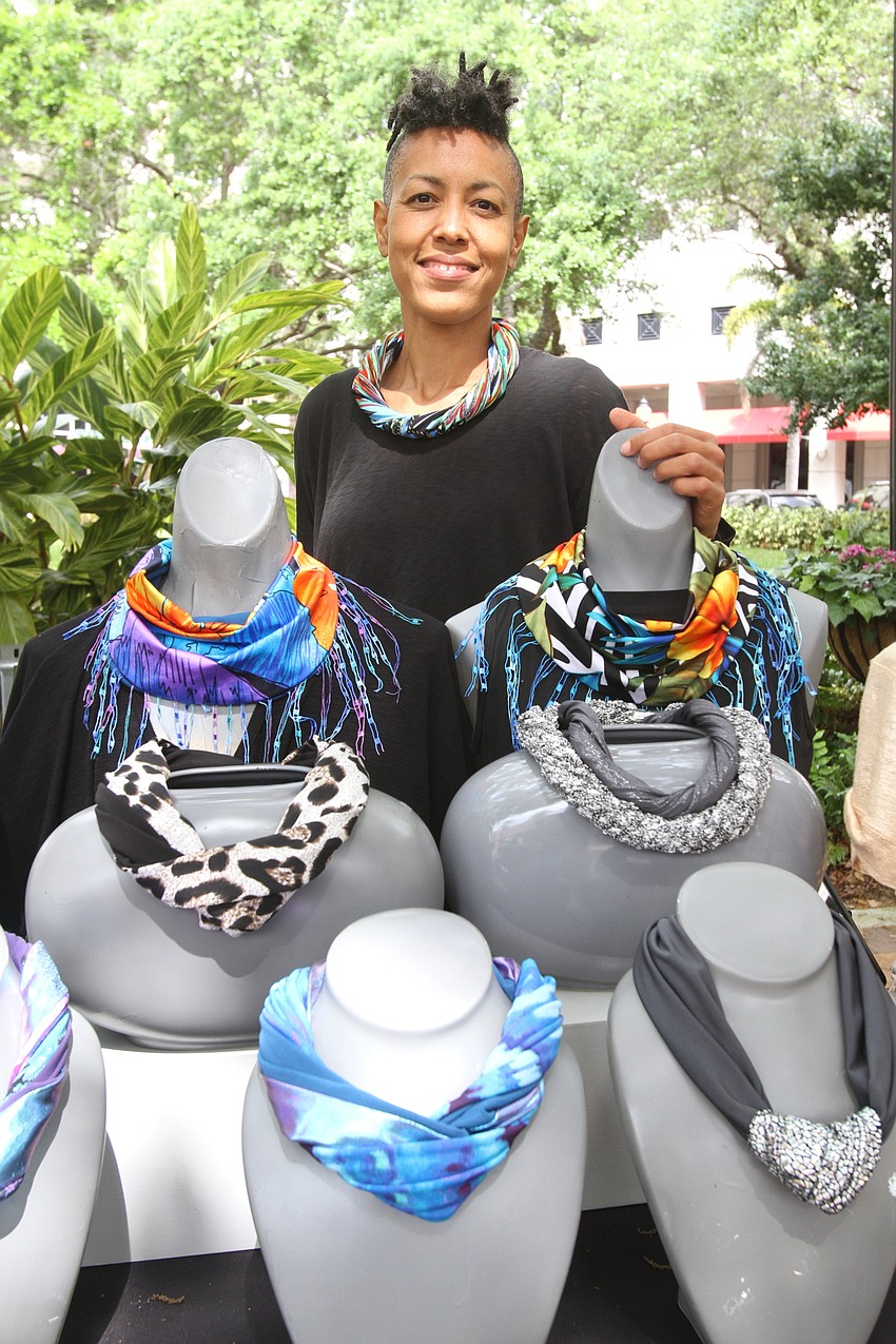 Ruth Miner sells magnetic scarfs.