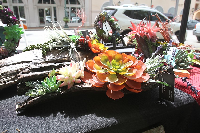 Rosemary Wright has driftwood pieces embellished with succulents at Rosemary's Relics.