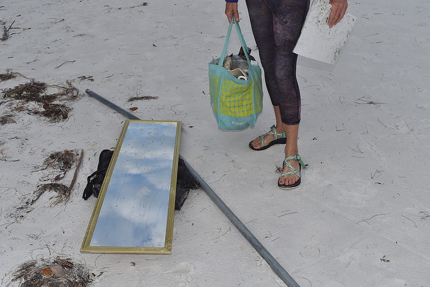 Cyndi Seamon pauses by the mirror and pole.