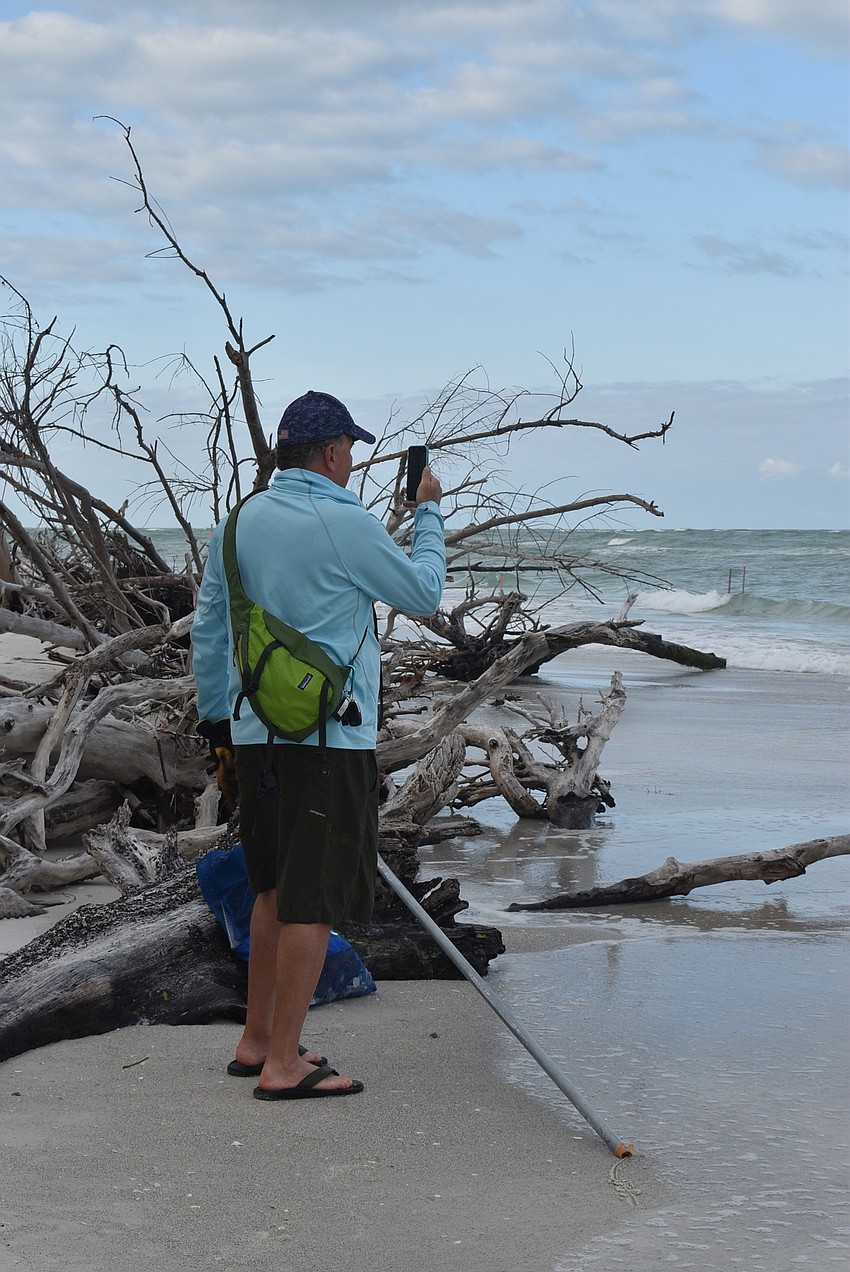 Brian Maddox stops to snap a photo of the gulf.