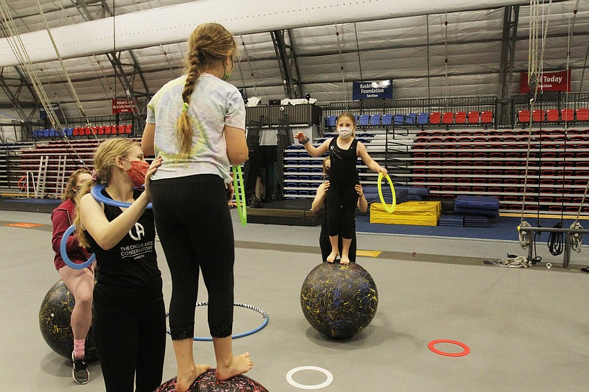 Iris Dalhborg and Zoe Bourgoing throws hoops back and forth with Ella Moulton and Sarah Cacalano
