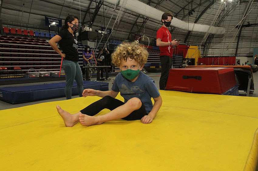 Tom Parish falls onto the mat.