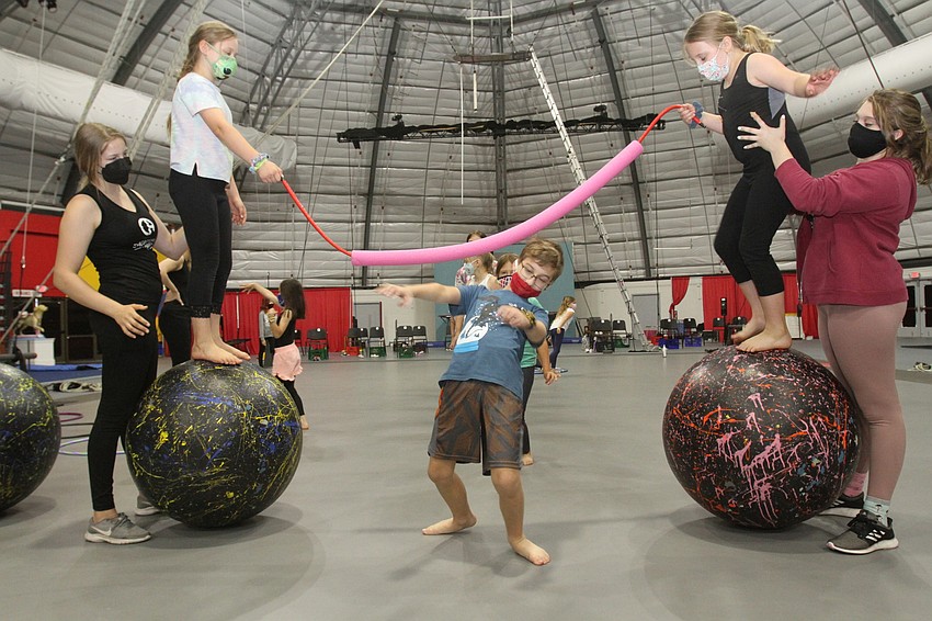 The campers get into a more involved game of limbo.