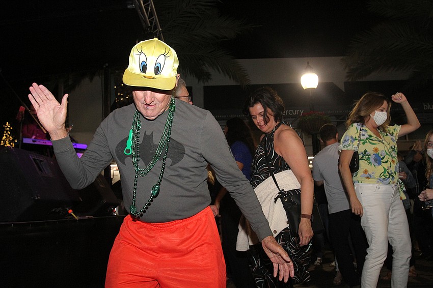 Chuck Bournival dances along with the crowd.