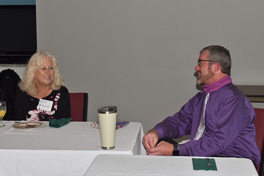 Renee Lynch chats with Rev. Brock Patterson.