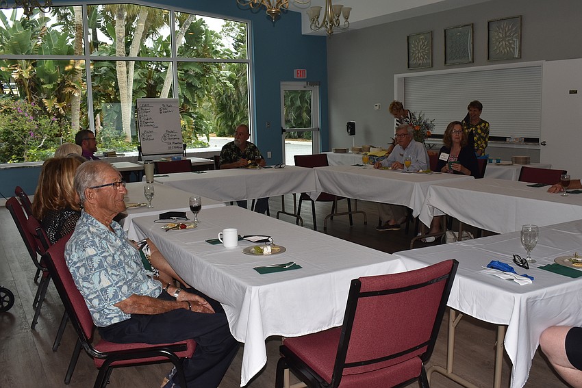The tables were arranged in a rectangle to allow for social distancing and to make it easier for attendees to see everyone they were talking to.