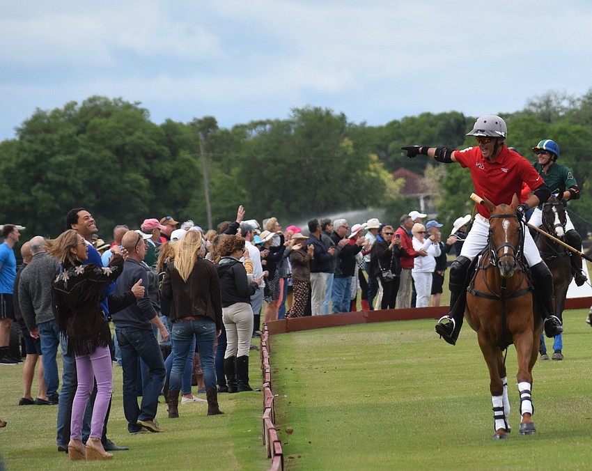 Sarasota Polo Club owner James Miller acknowledges the fans before the Observer Cup March 21.