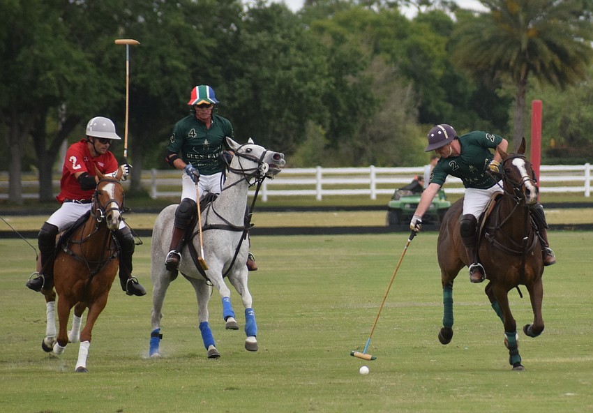 Hillcroft Farm's Herndon Ratcliff rushes toward the ball past Glen Farm's Stuart Campbell while Will Borland heads toward the goal.