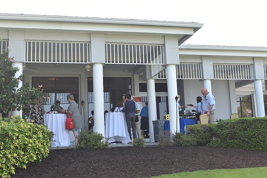 Attendees spread out onto the terrace to eat and see other vendors.
