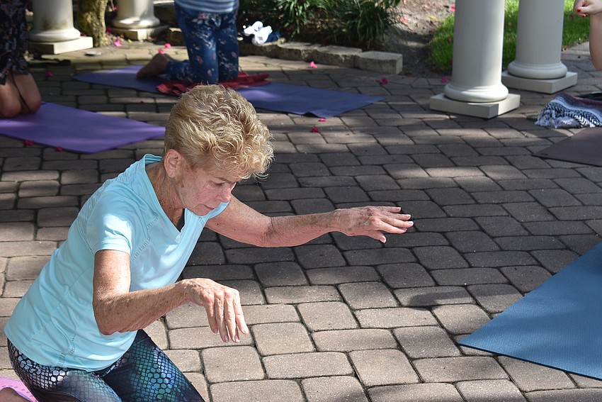 Marj Kirchner rotates her wrists.