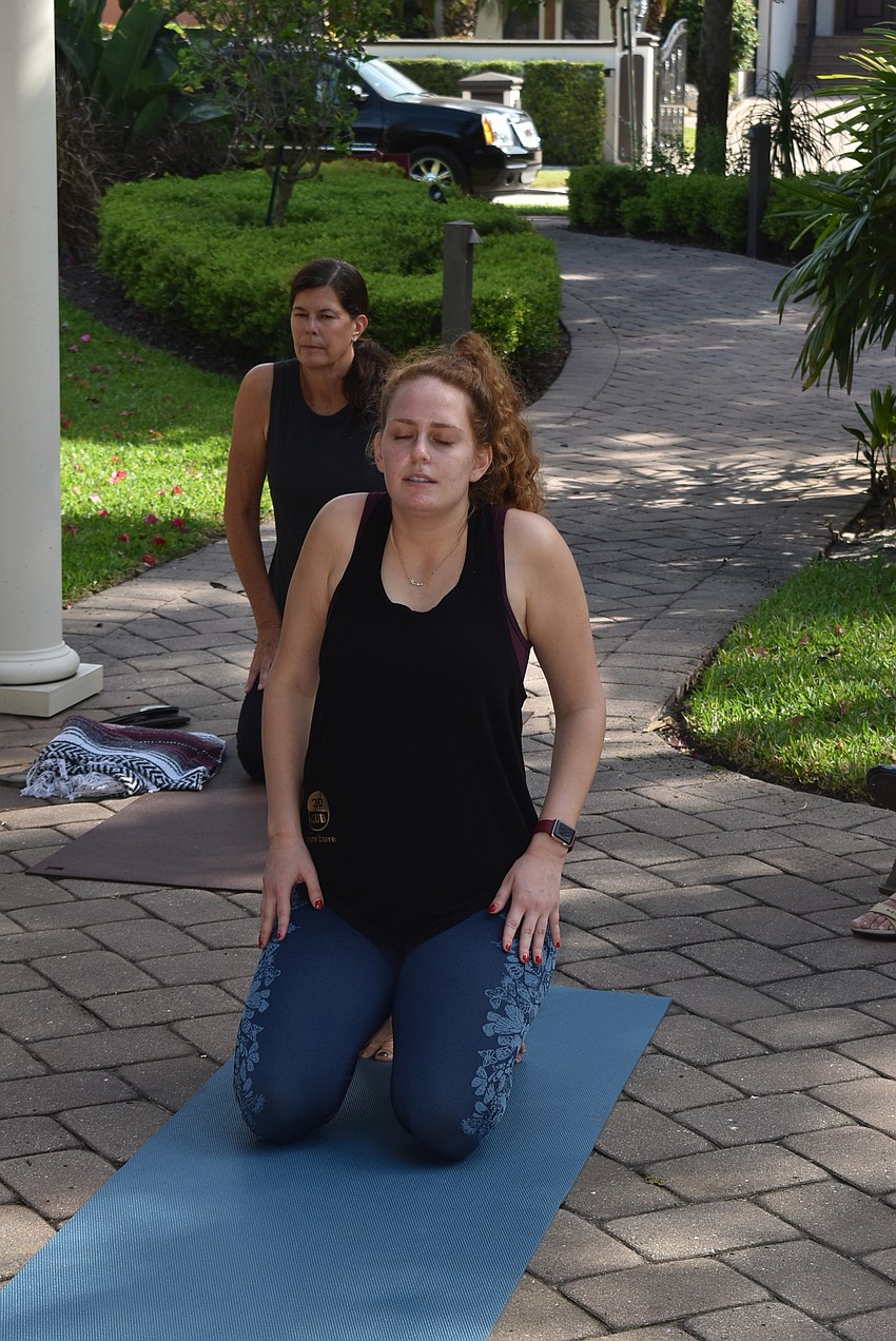 Nina Vannucci leads attendees through shoulder rolls.