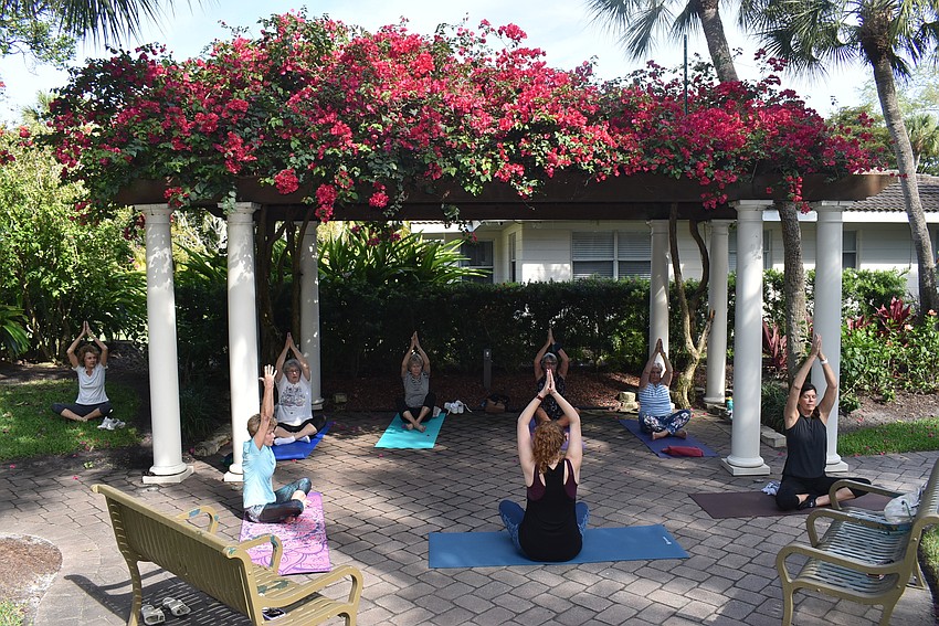 Nina Vannucci takes her students through floor-based stretches.