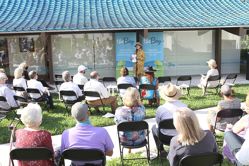 Donors and supported sit and enjoy the ribbon-cutting event.