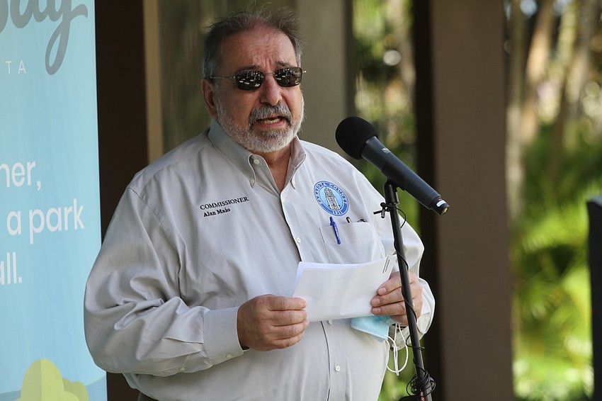 Commissioner Al Maio speaks to the audience.