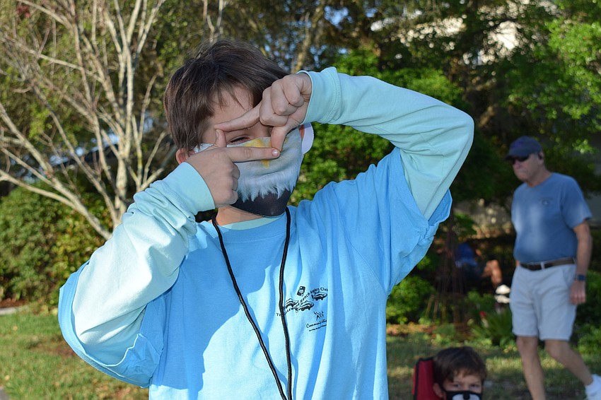 Bradenton's Elijah Tirado, who is 10, scouts where the fish are in Lake Uihlein.