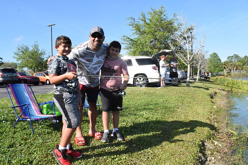 The Youth Fishing Tournament was all about quality time for 7-year-old Leo Ozgun, his dad, Ozzie Ozgun, and 9-year-old brother Tyler Ozgun.