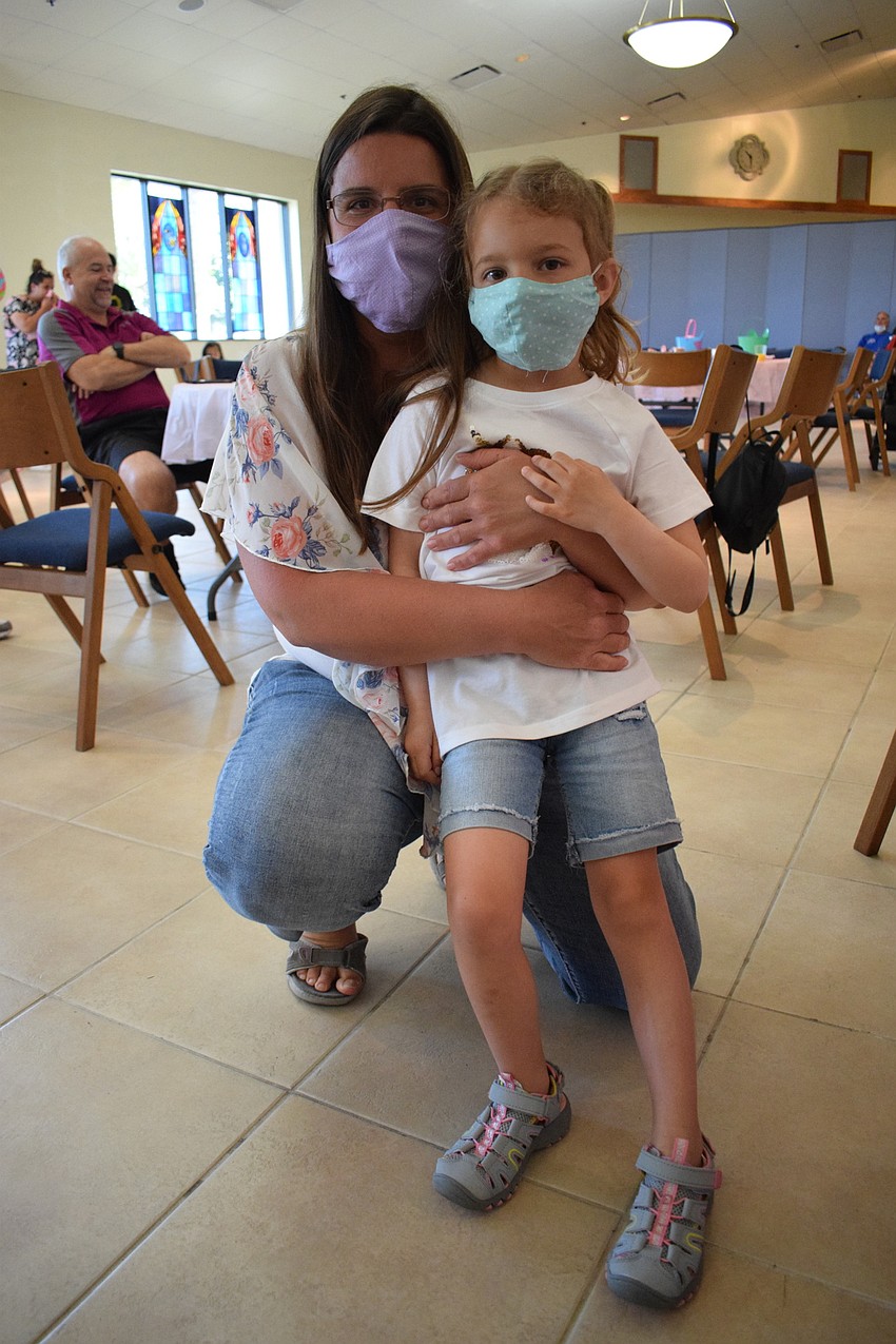 Rachel Jensen and her 5-year-old daughter dance together during the Easter Egg Hunt.