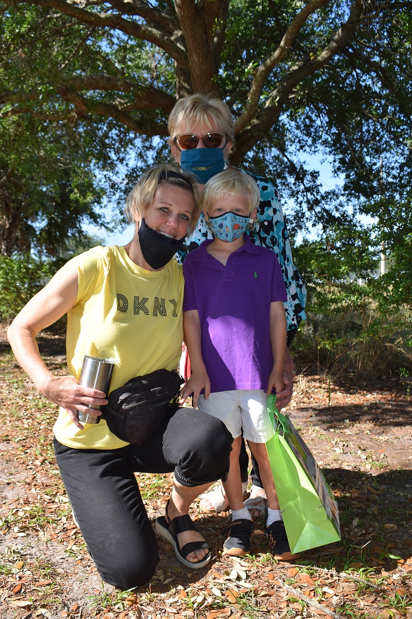 Heritage Harbour's Jamie Martin enjoys watching her 5-year-old son Ryan participate in the egg hunt with his grandmother Joyce Harpring, who is from Bridgewater.
