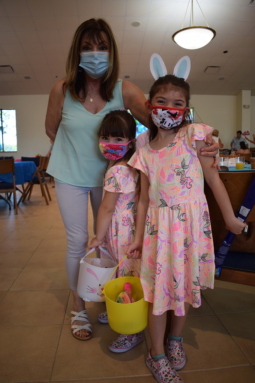 Lakewood Ranch's Linda Perhac spends time with 5-year-old Elise Perhac and 6-year-old Ava Perhac at the Easter Egg Hunt. 