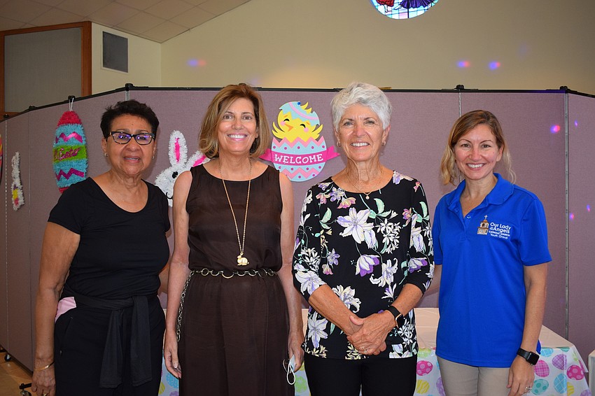 Maria Baez, Barbara Petrus, Jennifer Chapman and Tracey Lento help the Knights of Columbus during the Easter Egg Hunt.