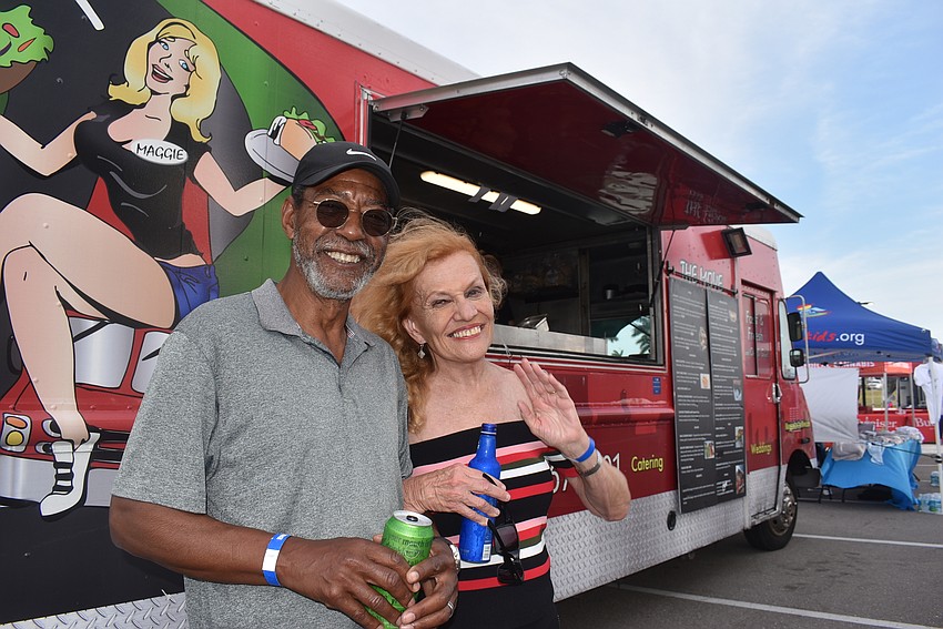Country Club residents Bill Thornton and Brenda Kahn are music lovers who were especially excited to see Tim Reynolds. They ordered Mo Rockin Shrimp and a gyro from the Maggie on the Move food truck.
