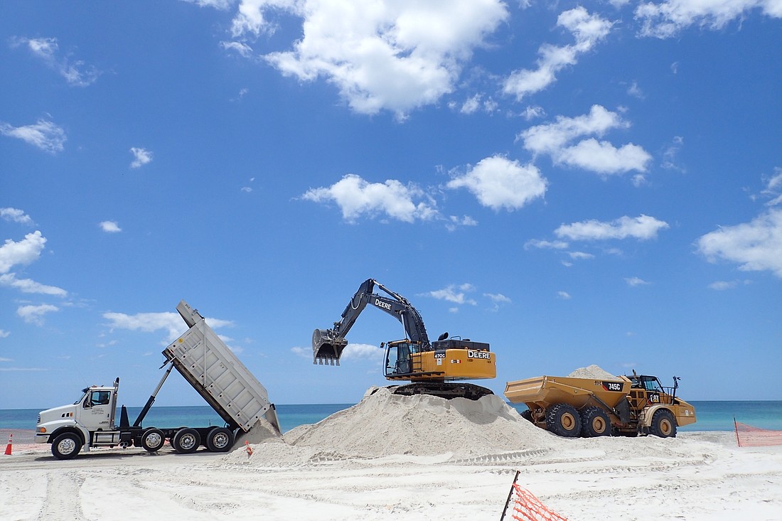 A quarter-scale test dune was created on Bradenton Beach to rest the feasibility.