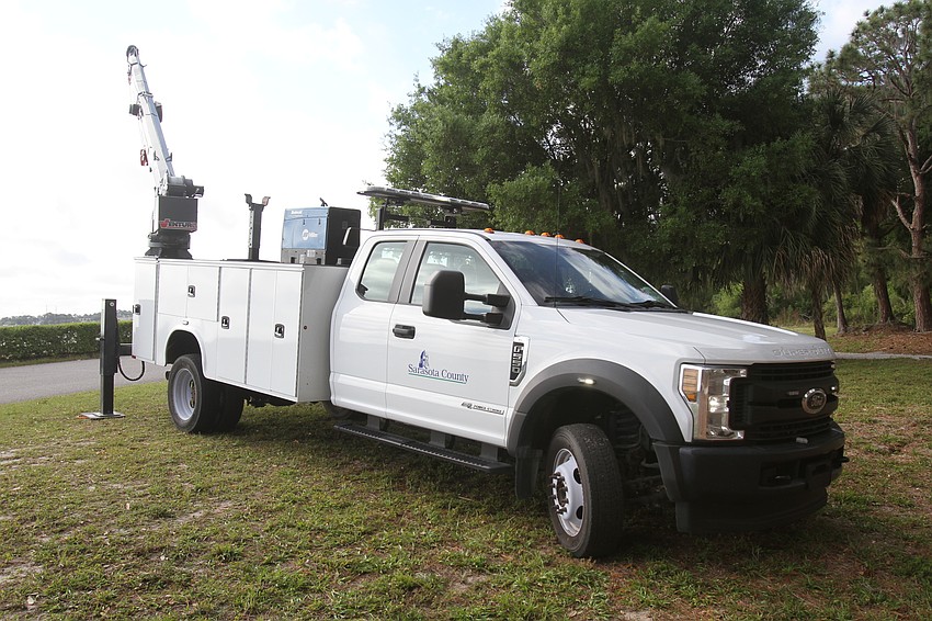 Families check out a crane truck.