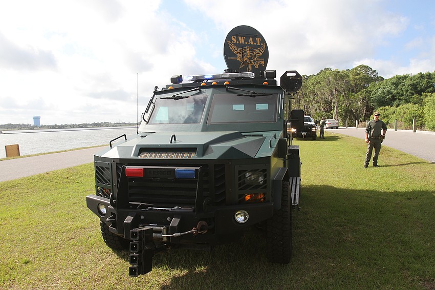 Families look at the BearCat SWAT car.