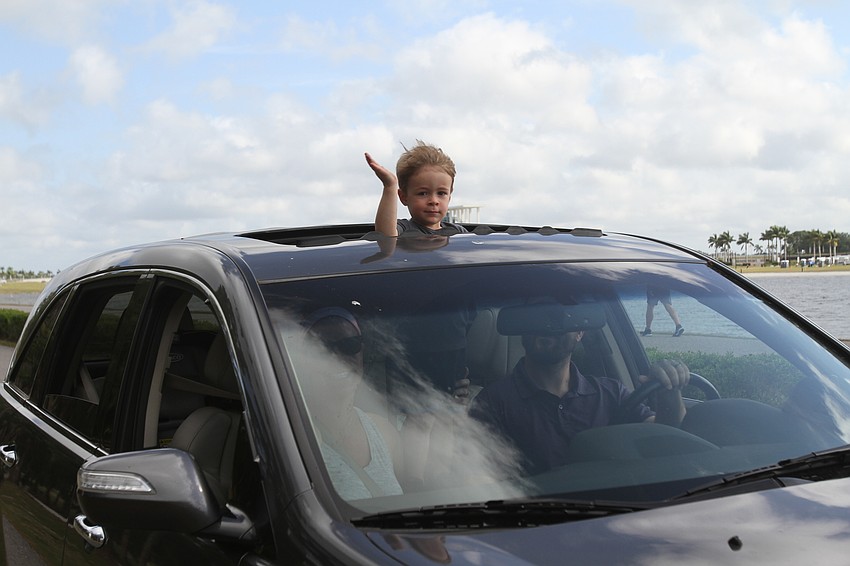 Sarasota resident Brooks Menke waves hey.