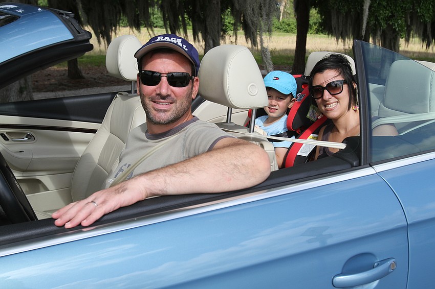 Olivier and Alex Cottalorda drive with Laeitita Sanchez with the top down.