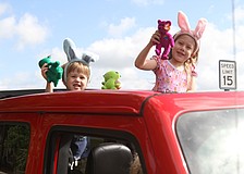 Lakewood Ranch kids Palmer and Emma Naumann play with plush dolls.