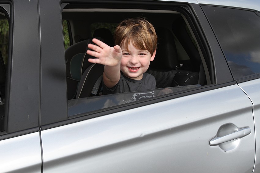 Seminole resident Logan Rockhill waves hello to everyone he met.
