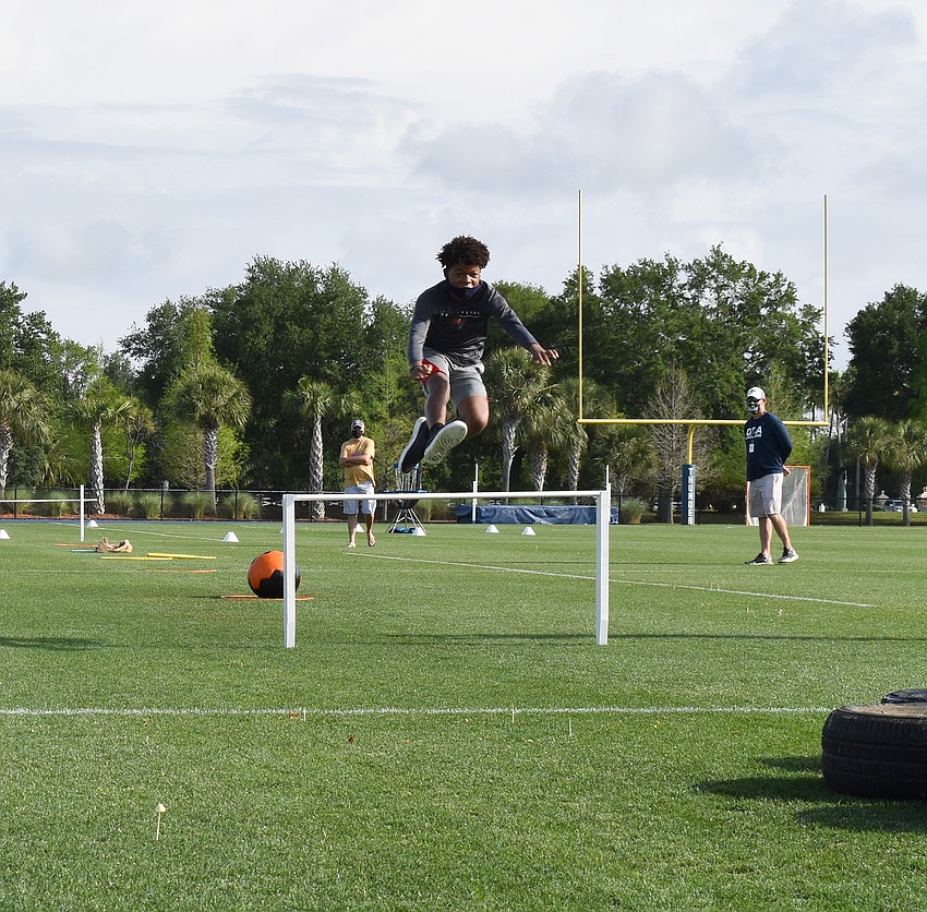 Frankie Clark Jr., an eighth grader, has no problem jumping  over a hurdle. Courtesy photo.