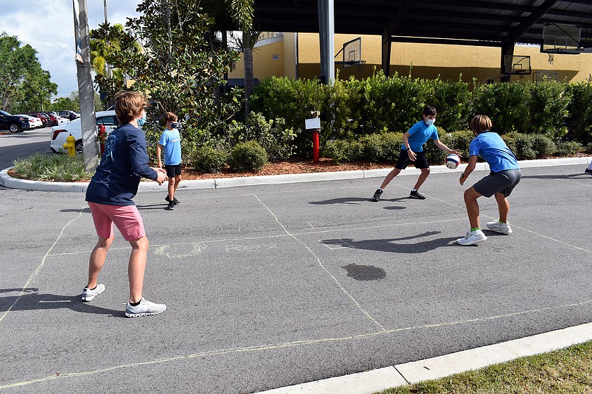 Seventh graders Hayden Hornback, Avery Fulk, Ryan Beck, and Javier Rodriguez play a fierce game of 4-square. Courtesy photo.