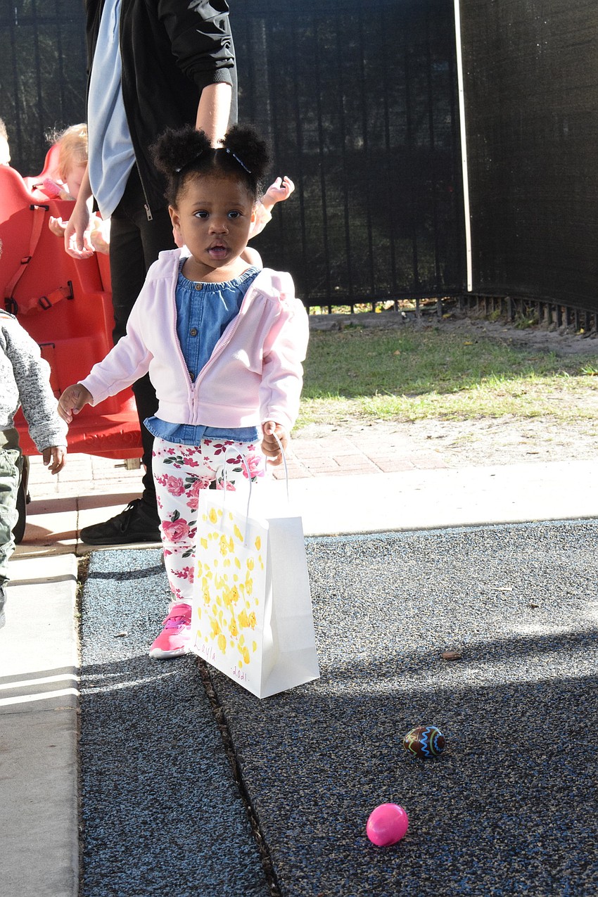 Layla Vonador, who is 1 year old, gets ready to start hunting eggs.