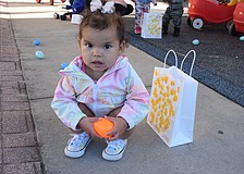 Pynelopee Redmond, who is 1 year old, snatches an egg to add to her collection.