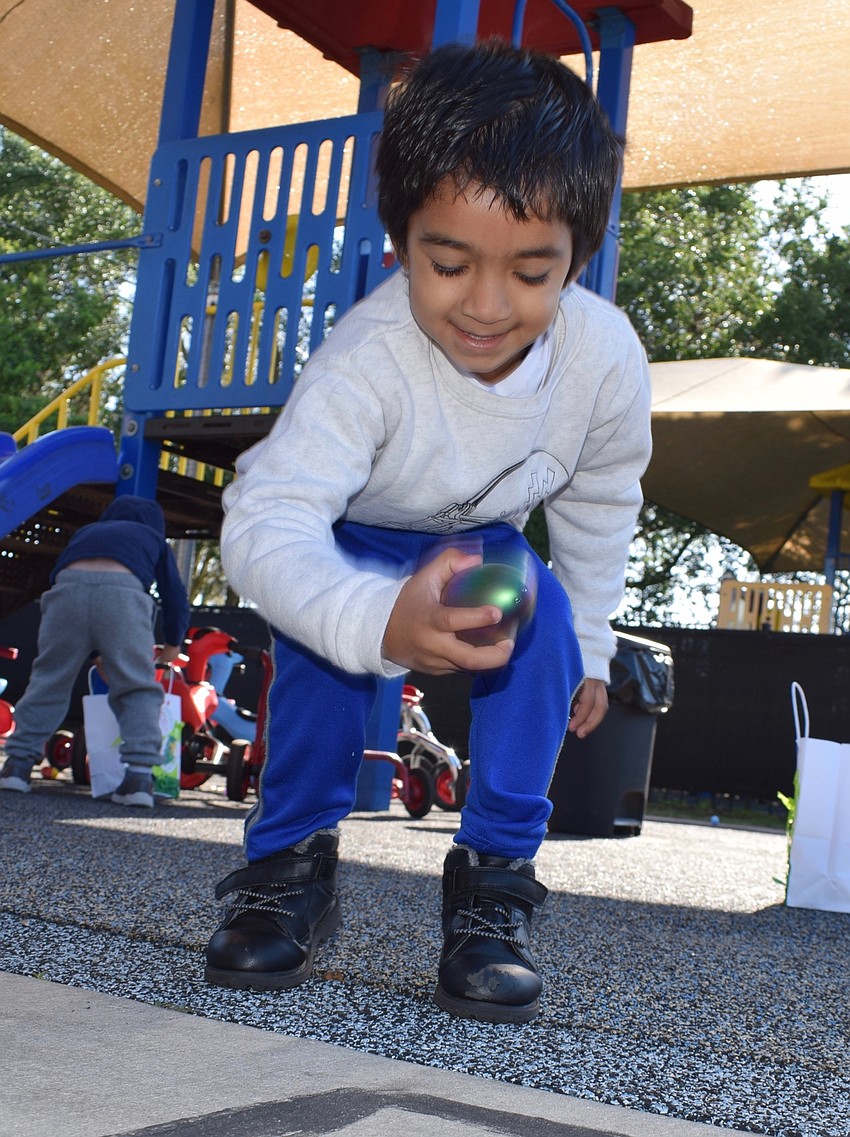 Shaan Patel, who is 4 years old, is excited to find another egg.