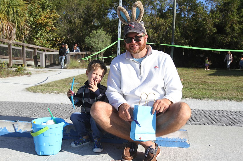 Gus and Adam Gorecki sit with their eggs.