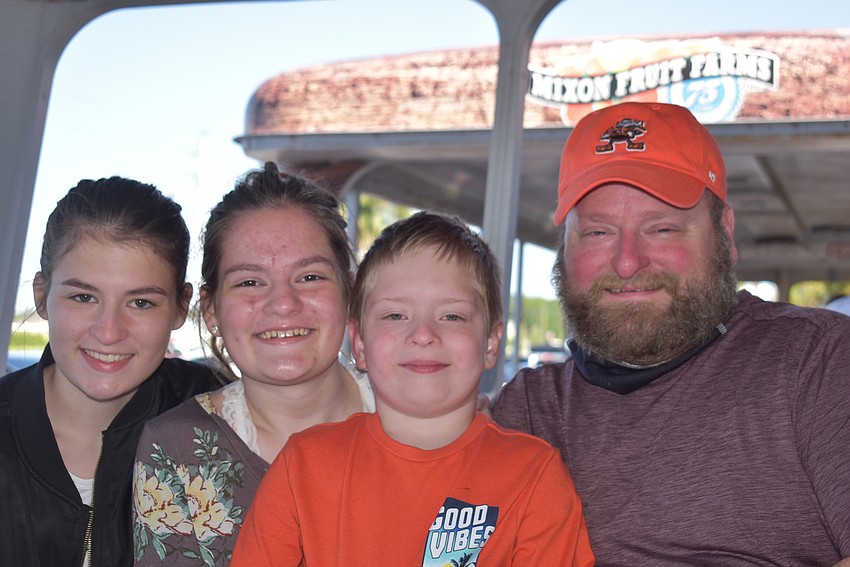 Cleveland area residents Sabrina Widmer, 17, Emma Widmer, 15, David Widmer, 6, and Brad Widmer decided to ride the trolley as soon as they arrived. They went to the fair because they were looking for something fun to do.