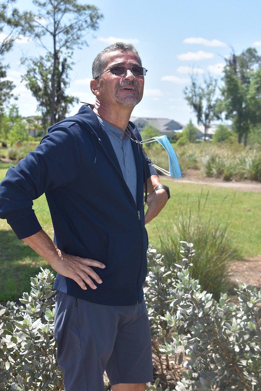 Indigo resident Cecilio Echeandia watches Indigo resident Anzhela Page's shot fly over the basket on the first hole.