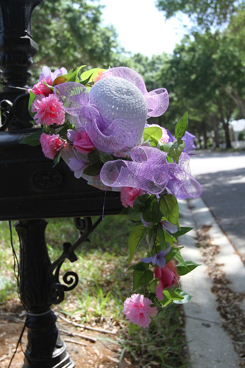 Some residents let flowers hang down from their mailboxes.