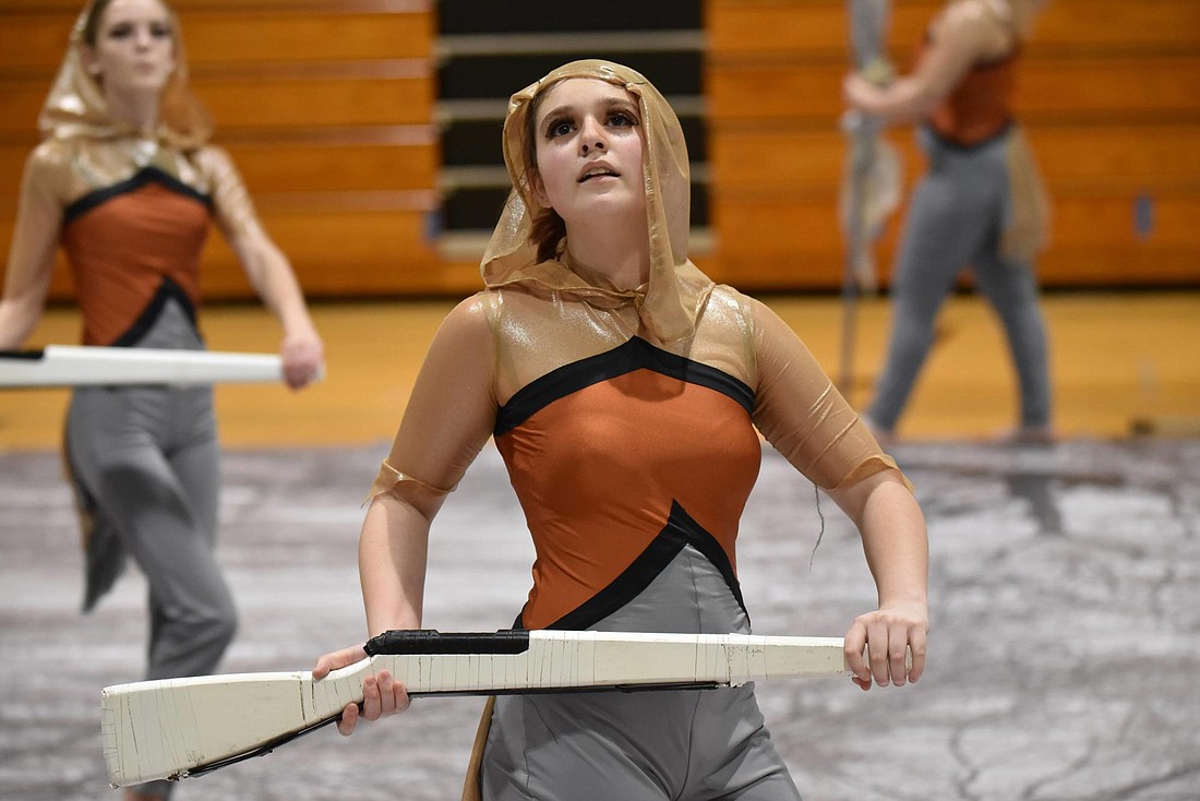 Brianna Schepers, a sophomore in the Braden River High School JV winter guard, uses a rifle during the guard&#39;s "Little Sparrow" performance. Courtesy photo by Chris Stratford.