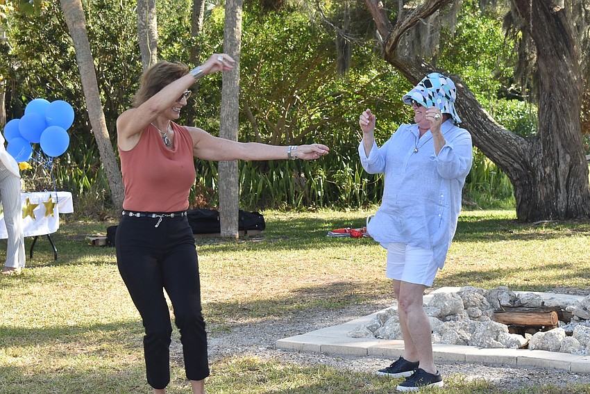 JoDene Moneuse and Maureen Horn dance after the awards.