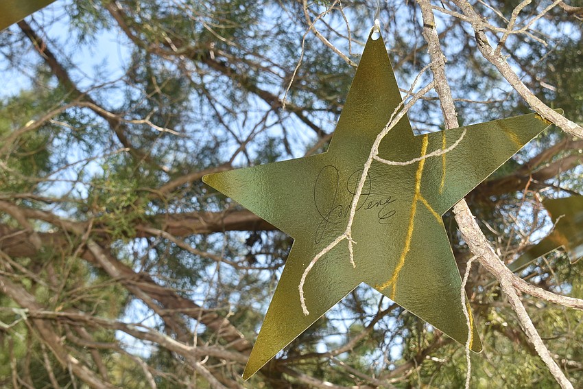 One tree was adorned with stars with the names of Michael Saunders realtors.