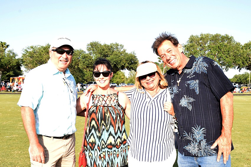 Sarasota's Dave Carlson, Stephanie Shapiro, Marie Elisa Font and Nick Vlakos attend Sunset Polo with Sarasota Over 50 Meet Up group.