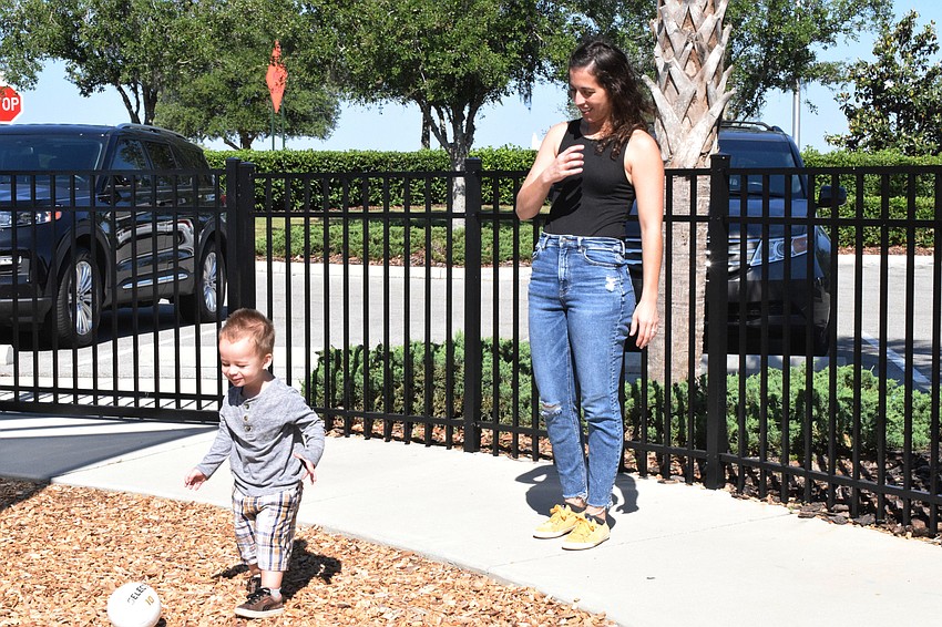 Harmony's Jack Hall, who is 20 months old, plays soccer with his mother, Sandra Hall.