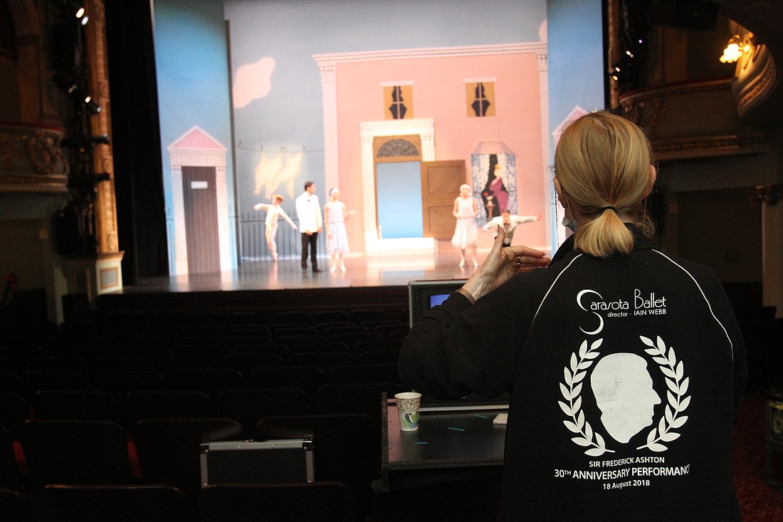 Assistant Producer Margaret Barbieri directs the performers from the seats.