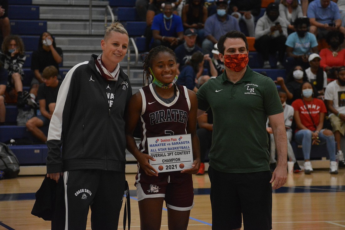 Pirates Coach Stephanie Smith, Braden River senior O&#39;Mariah Gordon and Lakewood Ranch High boys basketball Coach Jeremy Schiller celebrate Gordon&#39;s overall 3-point contest win. Gordon made 13 shots in one minute in the finals.